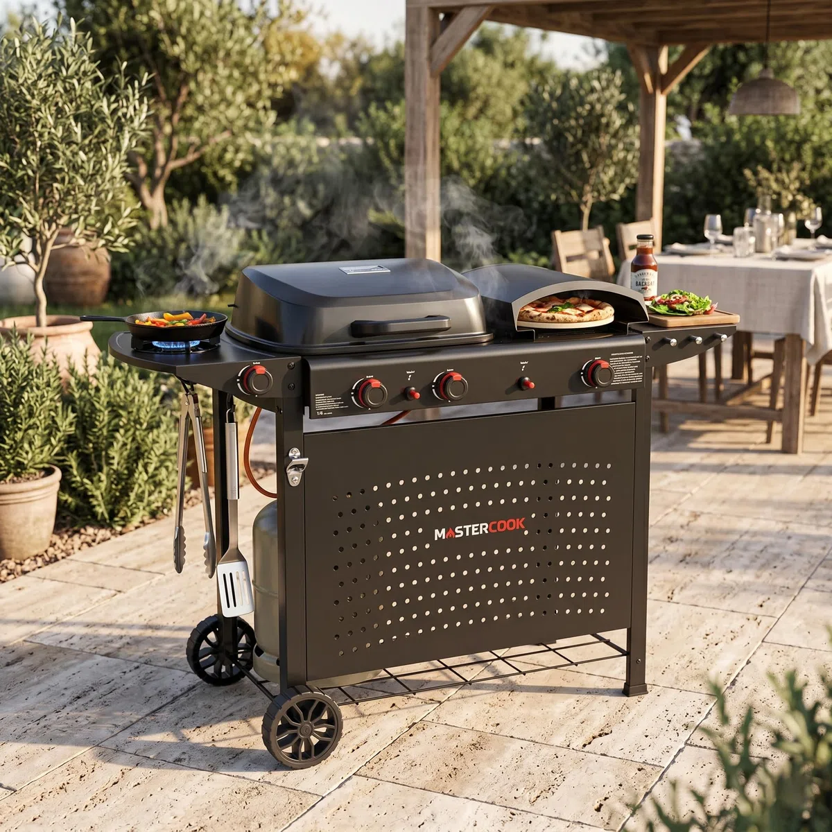 MasterCook - Barbecue a Gas Multifunzione con Griglia, Piastra e Forno Pizza, BBQ 2 Bruciatori con Fornello Laterale, Carrello con Ruote e Tavolino Pieghevole, 130,5x51,5x91,5 cm